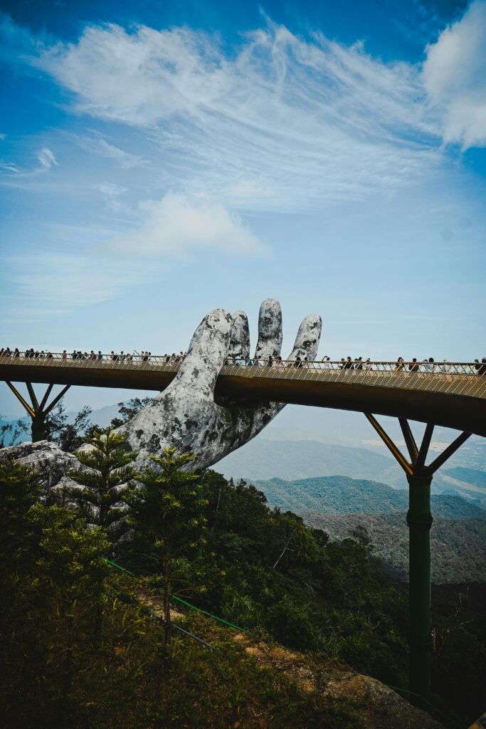 The iconic Golden Bridge held by giant hands at Ba Na Hills, Da Nang.