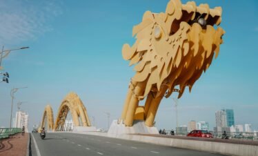 Stunning view of the iconic Dragon Bridge in Danang under a clear blue sky.